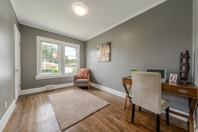 office space featuring crown molding and wood-type flooring