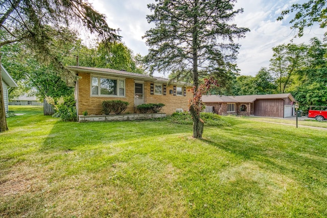 ranch-style home with a front lawn