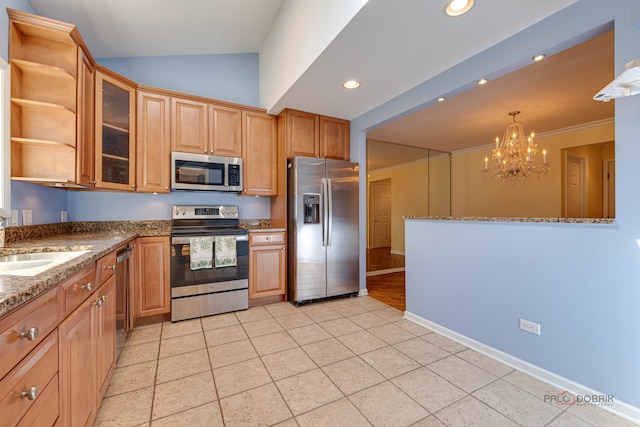 kitchen featuring lofted ceiling, light tile patterned floors, a chandelier, pendant lighting, and stainless steel appliances