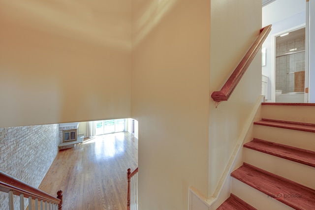 stairway featuring hardwood / wood-style floors