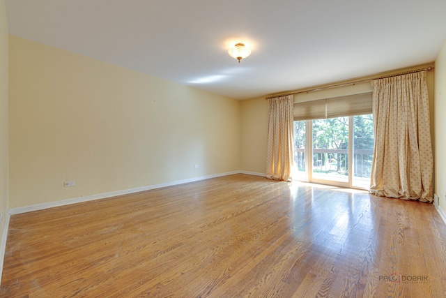 spare room featuring light wood-type flooring