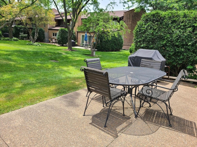 view of patio featuring a grill