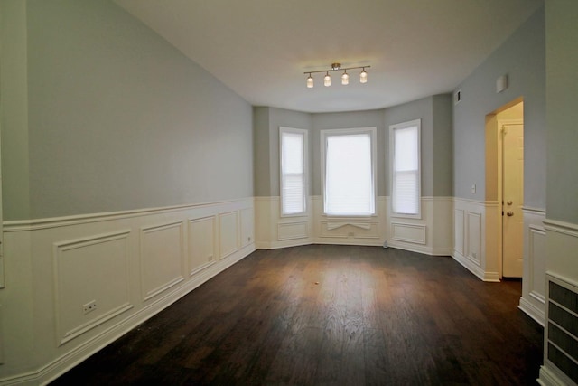 unfurnished room with dark hardwood / wood-style floors