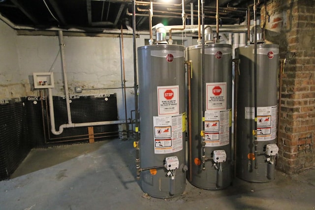 utility room featuring water heater