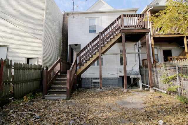 rear view of property with a wooden deck