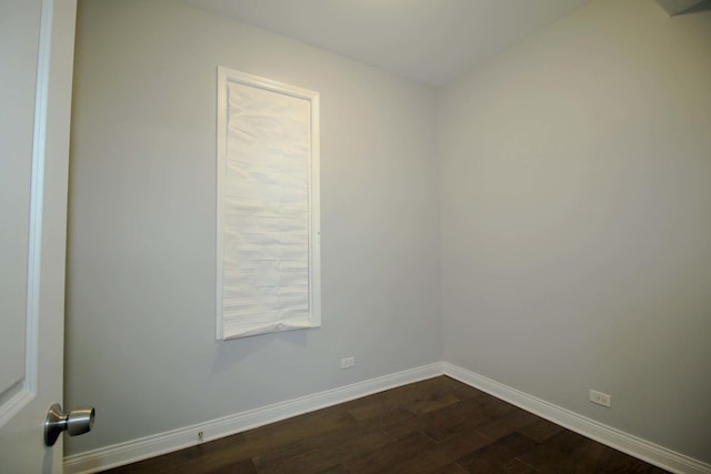 spare room with dark hardwood / wood-style floors