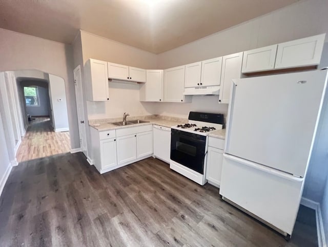 kitchen with dark wood-type flooring, white appliances, sink, and white cabinets