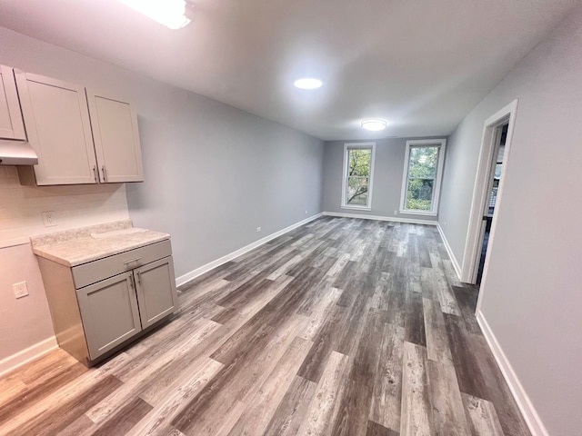 unfurnished living room featuring dark wood-type flooring