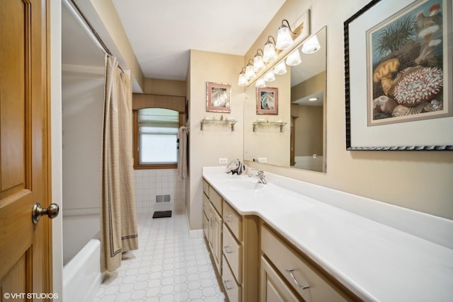 bathroom with visible vents and vanity