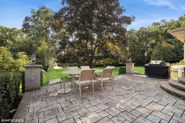 view of patio / terrace featuring area for grilling and outdoor dining space