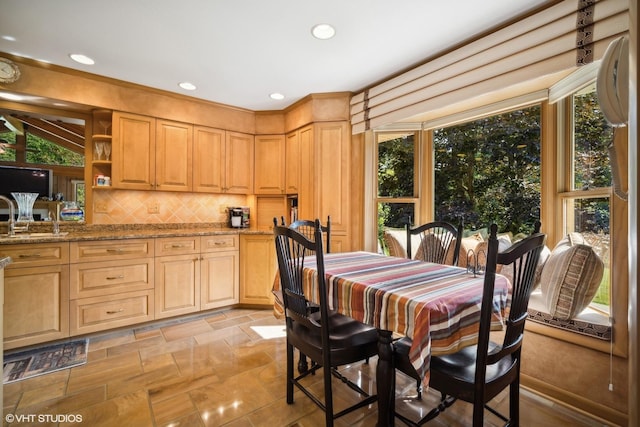 dining room with recessed lighting and stone finish flooring