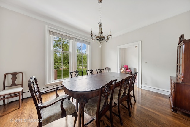 dining area with dark wood-type flooring and an inviting chandelier