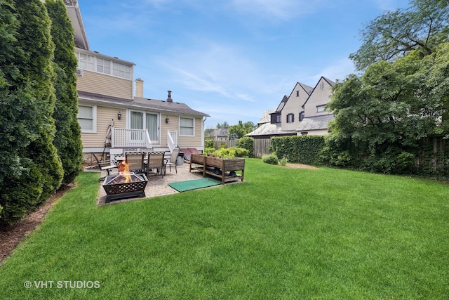 view of yard with a patio and a fire pit