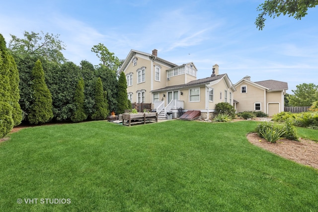 rear view of property featuring a yard