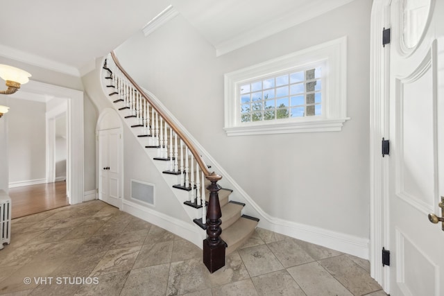 stairway with crown molding