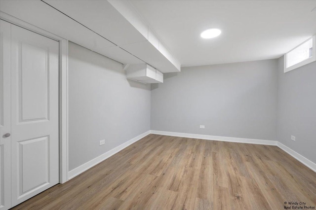 basement featuring light hardwood / wood-style flooring