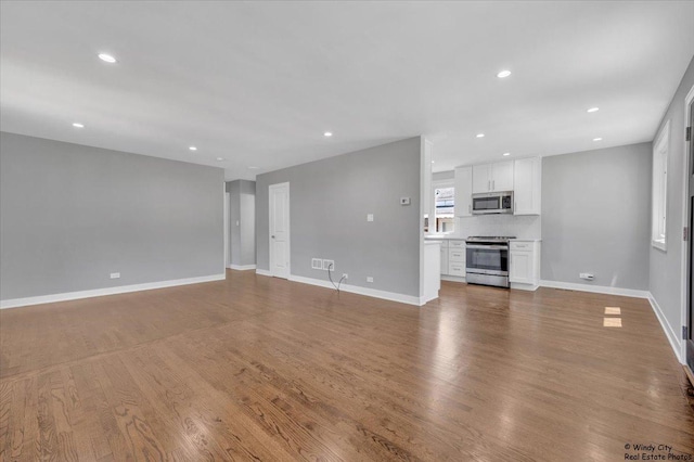 unfurnished living room featuring light hardwood / wood-style floors