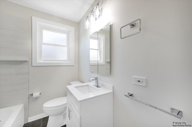 bathroom featuring tile patterned flooring, vanity, toilet, and a bath