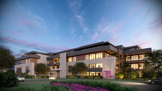 view of outdoor building at dusk