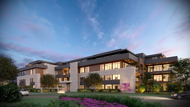 view of outdoor building at dusk