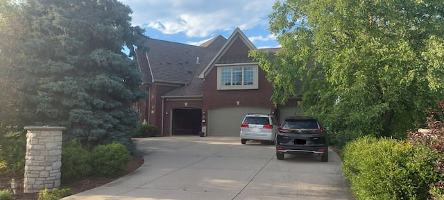 view of front of property featuring a front yard and a garage