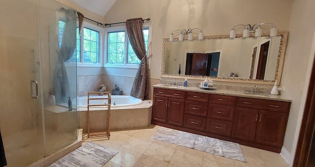 bathroom featuring shower with separate bathtub, vaulted ceiling, tile flooring, and double vanity