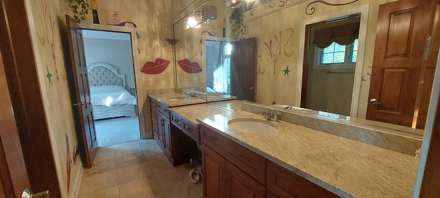 bathroom featuring tile flooring, oversized vanity, and double sink