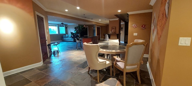 dining area with tile flooring, ceiling fan, and crown molding