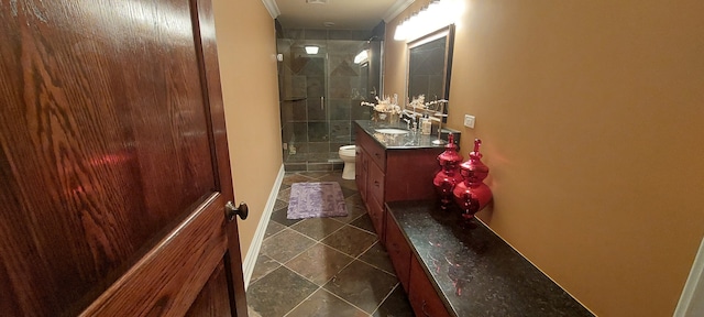 corridor featuring sink, dark tile floors, and crown molding