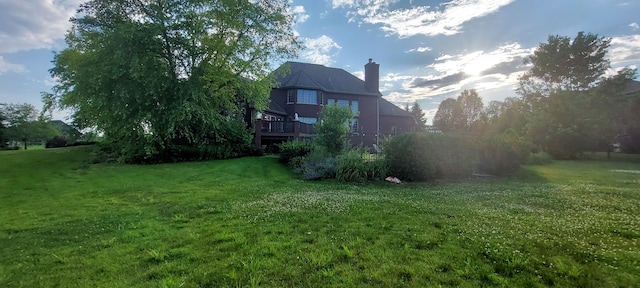 view of yard featuring a wooden deck