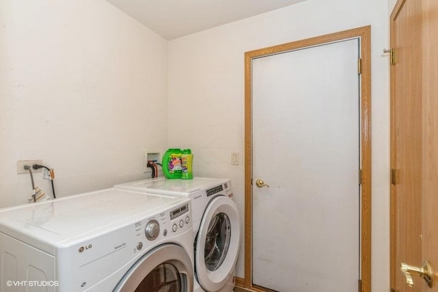 laundry room with independent washer and dryer