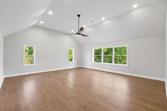 unfurnished living room featuring ceiling fan, dark hardwood / wood-style flooring, and lofted ceiling