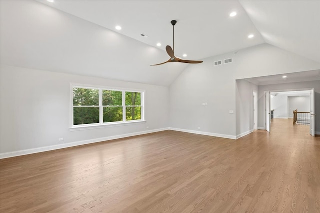 unfurnished living room with light wood-type flooring, ceiling fan, and lofted ceiling