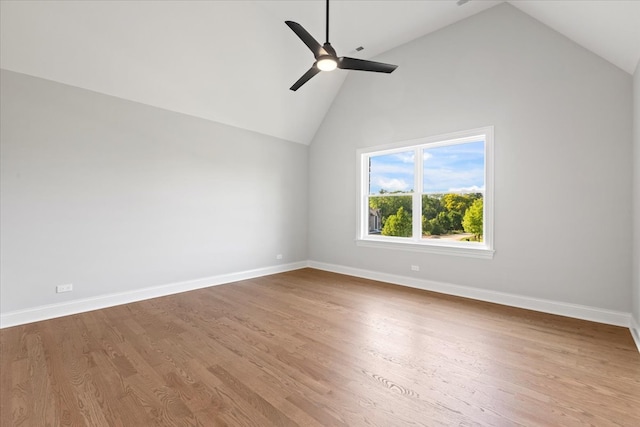 spare room with ceiling fan, high vaulted ceiling, and light hardwood / wood-style floors