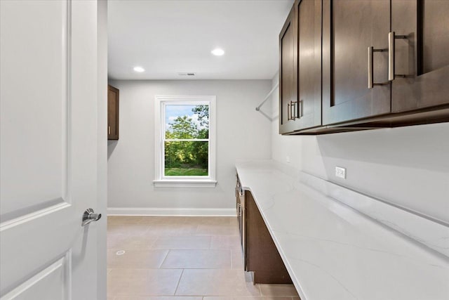 walk in closet featuring light tile patterned floors