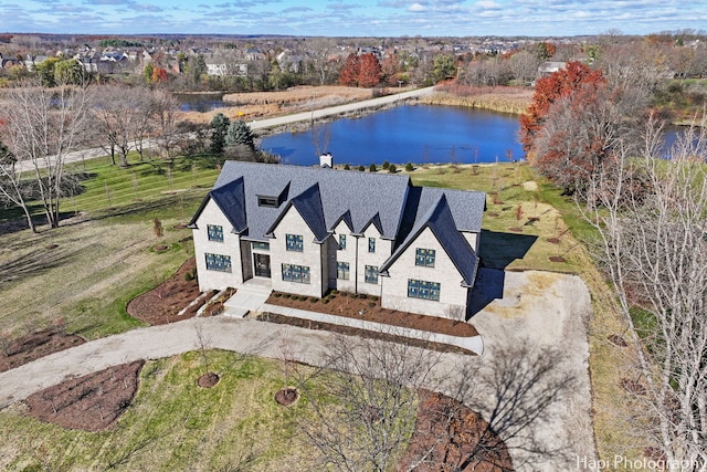 birds eye view of property with a water view