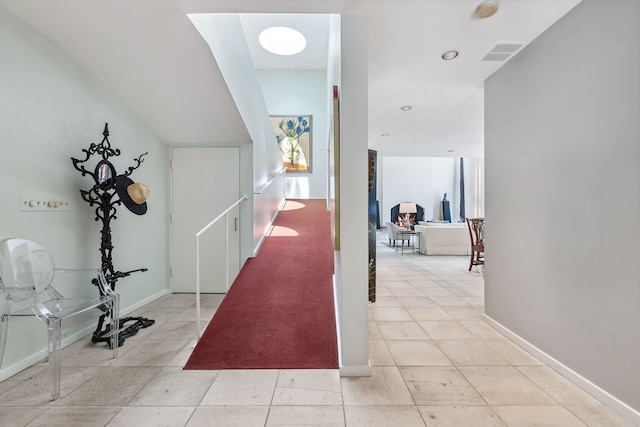 hallway with light tile floors