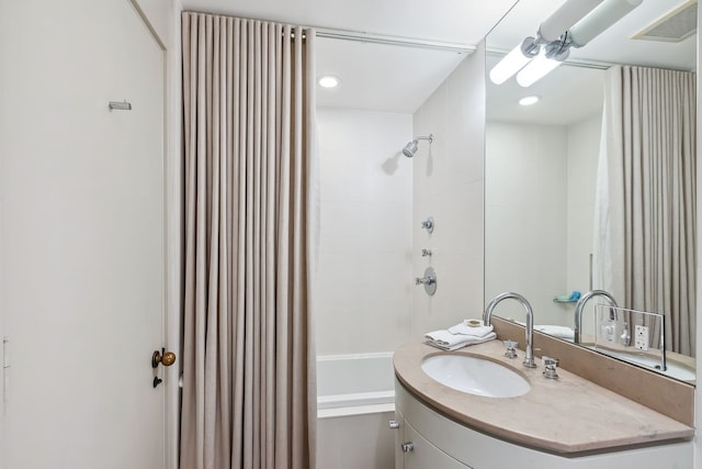 bathroom featuring vanity and shower / bath combo with shower curtain