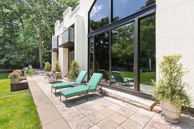 view of patio with a balcony