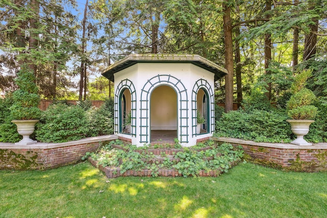 view of outdoor structure with a lawn