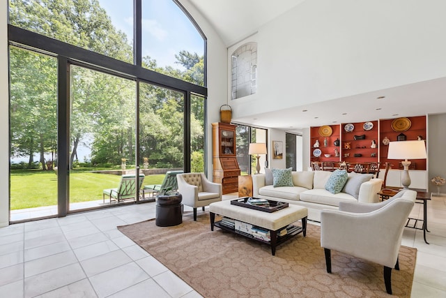 tiled living room featuring high vaulted ceiling and built in features