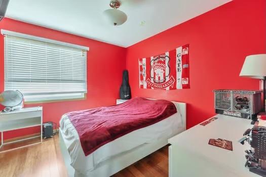 bedroom featuring hardwood / wood-style floors