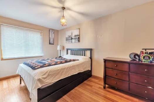 bedroom with light hardwood / wood-style floors