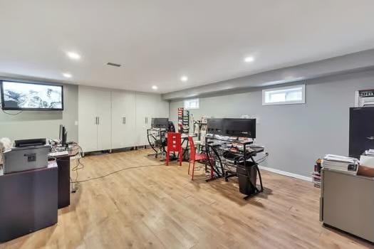 office with light wood-type flooring