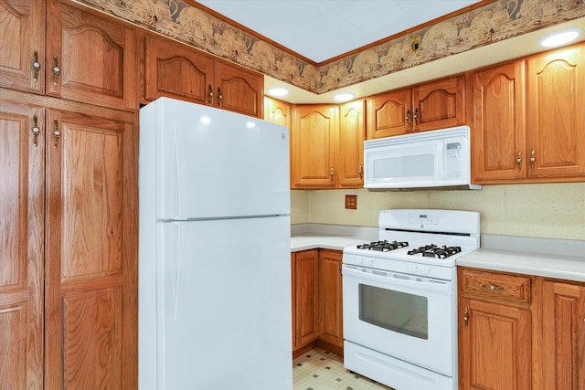 kitchen with white appliances and light tile patterned flooring