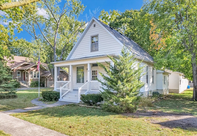 view of front of home with a front lawn and covered porch