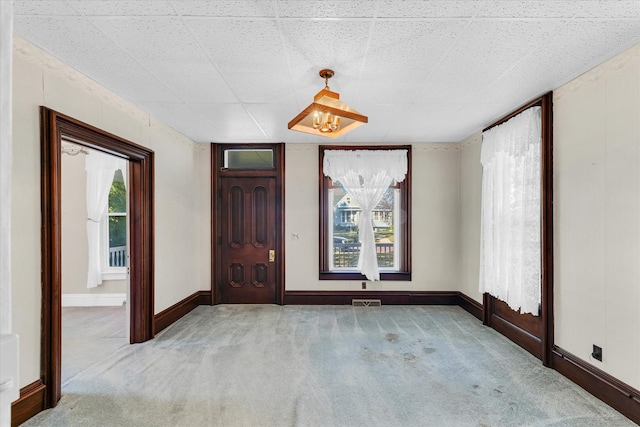 view of carpeted entrance foyer