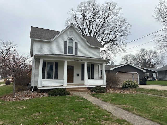 view of front of property with a front yard and covered porch