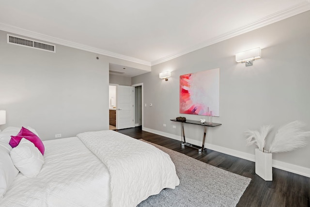 bedroom featuring dark hardwood / wood-style flooring and crown molding