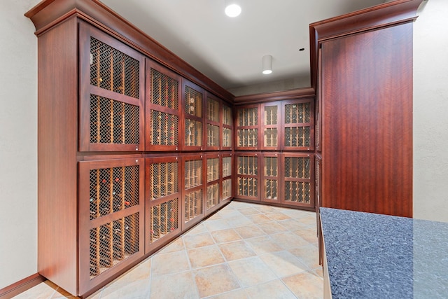 wine area featuring light tile patterned flooring